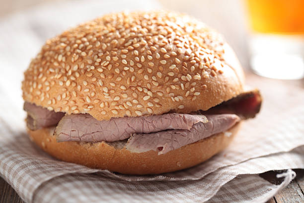 Roast beef sandwich Sandwich with roast beef on a napkin closeup roast beef sandwich stock pictures, royalty-free photos & images