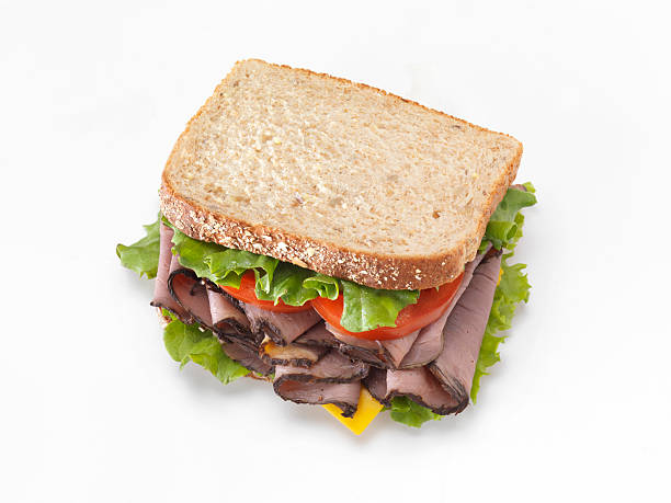 Roast Beef Sandwich "Roast Beef Sandwich shot from above with Lettuce, Tomato and Cheese - Photographed on a Hasselblad H3D11-39 megapixel Camera System" roast beef sandwich stock pictures, royalty-free photos & images