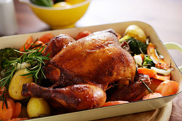 Roast chicken with vegetables stock photo