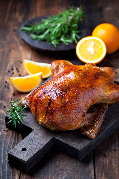 Roast duck Roast duck in orange glaze, selective focus goose meat photos stock pictures, royalty-free photos & images