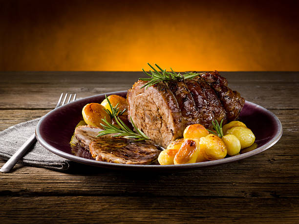 roast of veal with potatoes stock photo
