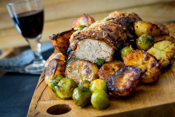 Roast Pork Loin Roast Pork Loin with trimmings roast dinner stock pictures, royalty-free photos & images