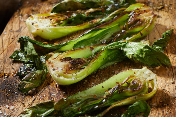 Roasted Baby Bok Choy Spicy  Roasted Baby Bok Choy with Salt, Pepper and Chili Flakes cooked bok choy stock pictures, royalty-free photos & images