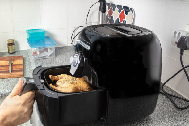 Roasted chicken in the hot air fryer / oven stock photo