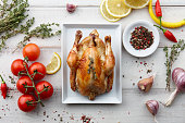 Roasted chicken with herbs and spices for Christmas or Thanksgiving holiday dinner, top view