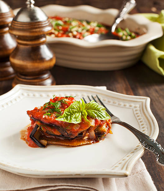 Roasted eggplant with tomato sauce. stock photo