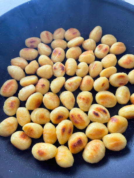 roasted gnocchi stock photo