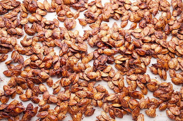 roasted maple spice pumpkin seeds stock photo