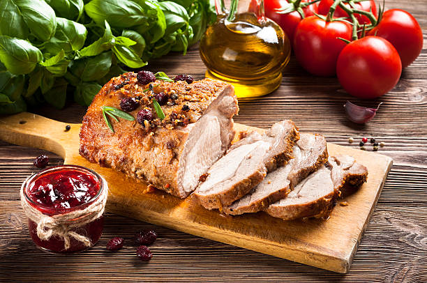 Roasted pork loin with cranberry and rosemary stock photo