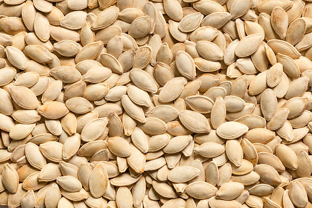 Roasted pumpkin seeds Backgrounds Textured stock photo