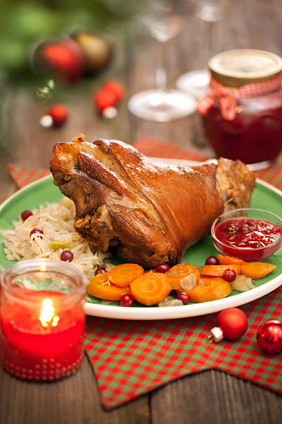 Roasted shank with cabbage and cranberry sauce. stock photo