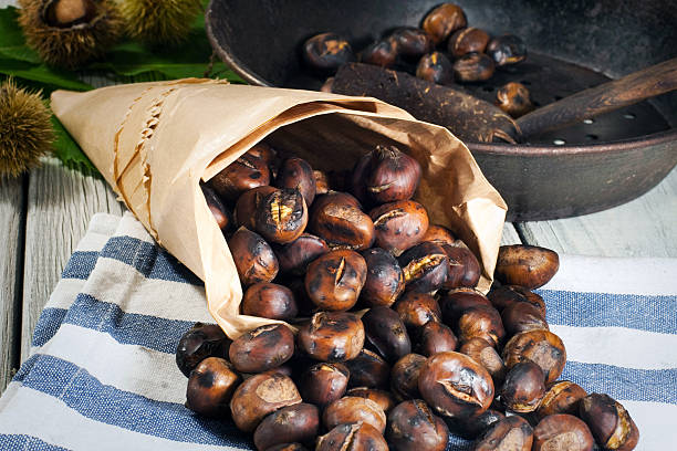 Roasting chestnuts  chestnut food stock pictures, royalty-free photos & images