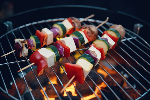 Roasting Vegan Skewers with Tofu, Bell Pepper, Zucchini and Onions stock photo