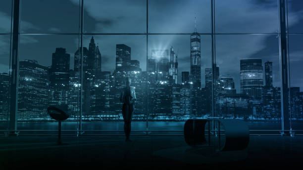 Robot in the office against the background of the night city, 3D render. stock photo