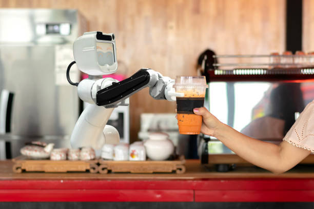 robot technology hold drinks to people work instead of man future stock photo