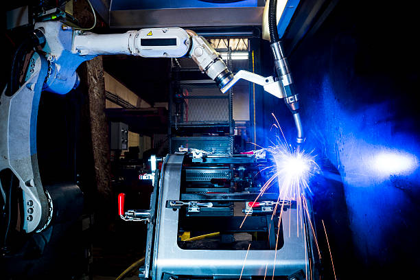 Robotic welding machine in a metal manufacturing plant A CNC robotic welding machine in a metal manufacturing plant. a great example of industrial automation on a smaller scale. defense industry stock pictures, royalty-free photos & images