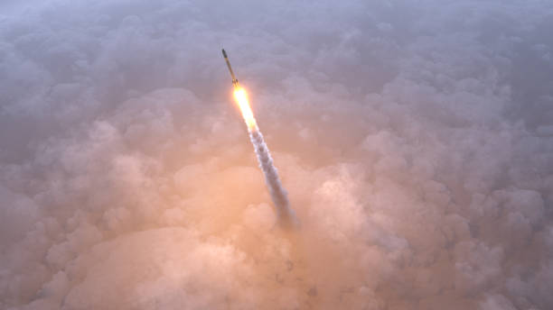 Rocket flies through the clouds stock photo