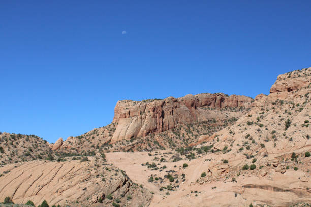 Rocks and Cliffs in the Rural Utah Desert Under Vibrant Blue Sky stock photo