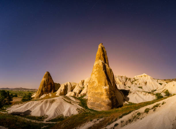 Rocks and the sky with stars. Cappadocia, Turkey. View of the rocks at night. Landscape in the summertime. UNESCO heritage. Vacation and tourism. stock photo