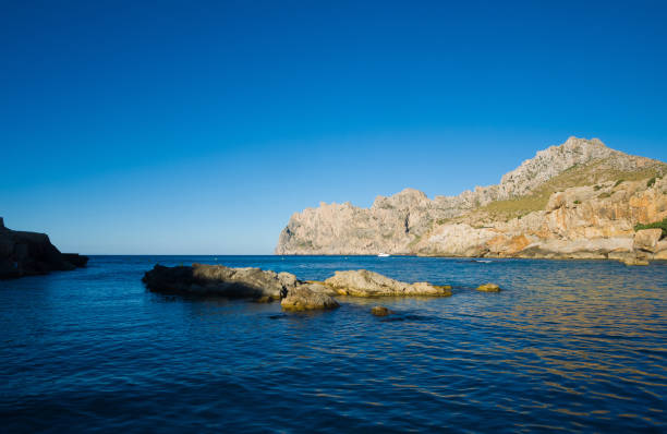 Rocks in water on Spanish coast stock photo