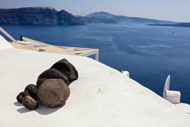 Rocks on roof in Oia Santorini stock photo