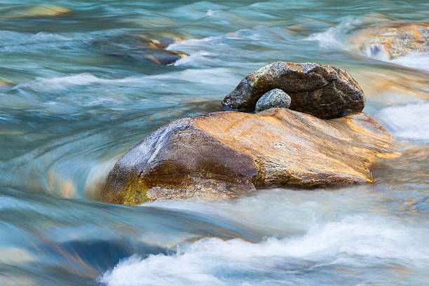 Rocks Rocks in a rapid river rapids river stock pictures, royalty-free photos & images