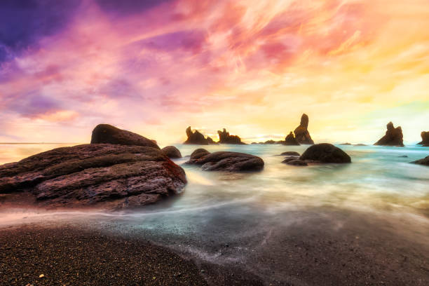 Rocky Beach on Pacific NorthWest Coast Rocky Beach on Pacific NorthWest Coast. Taken in Shi Shi Beach, Neah Bay, Washington, United States. Colorful Surreal Dramatic Sunset Artistic Render neah bay stock pictures, royalty-free photos & images