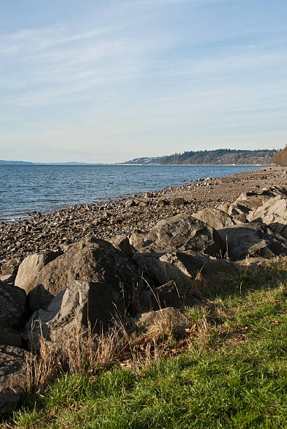 Rocky Beach on Puget Sound The landscapes and seascapes of Puget Sound are a constant source of inspiration for photographers. This picture of a rocky beach was photographed from Saltwater State Park near Des Moines, Washington State, USA. jeff goulden seascape stock pictures, royalty-free photos & images