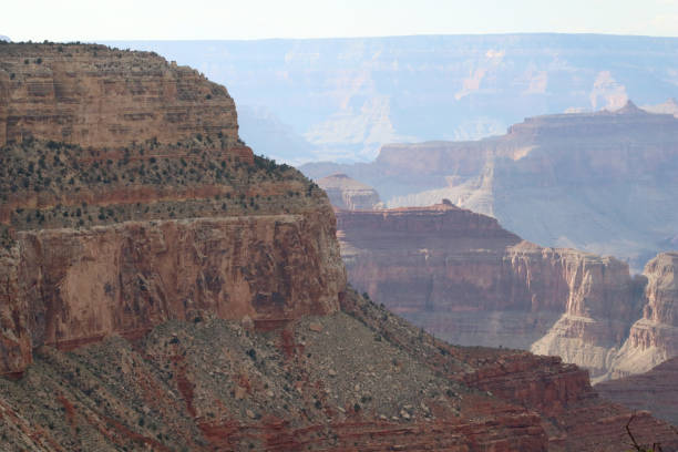 Rocky Cliff Landscape of the Grand Canyon with the Canyon and Haze in the Background stock photo