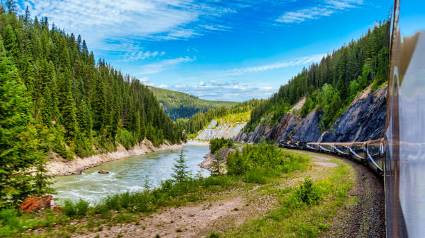 Rocky Mountaineer train traveling through the Rocky Mountains with luxury dining on board. stock photo