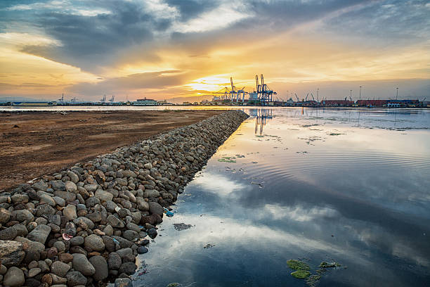 Rocky shores near the Djibouti port at dawn stock photo