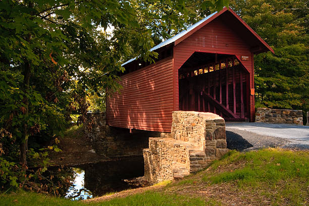 Roddy Road Covered Bridge Roddy Road covered bridge located north of Thurmont, Maryland. covered bridge stock pictures, royalty-free photos & images