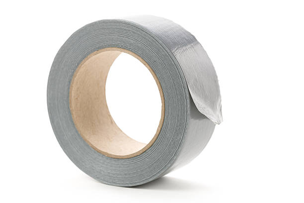 A roll of gray duct tape isolated on a white background stock photo