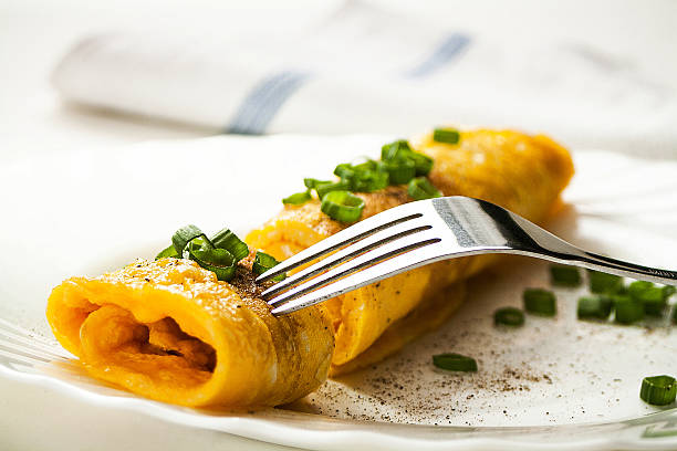 Rolled up, French style Omlette stock photo