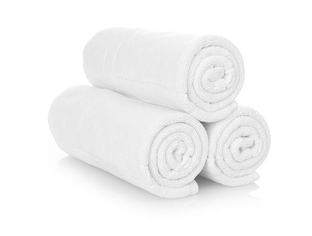 Rolled up white towels Clean white towels isolated on white towel stock pictures, royalty-free photos & images