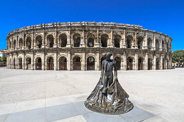 Roman Amphitheater in Nimes, France Details of Ancient Roman Amphitheater in Nimes, France amphitheater stock pictures, royalty-free photos & images