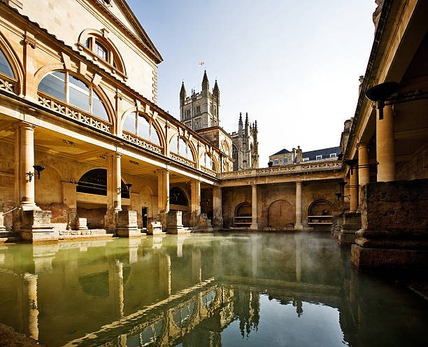 Roman Baths, Bath England Roman Baths with Bath Abbey reflection in Bath, England somerset england stock pictures, royalty-free photos & images