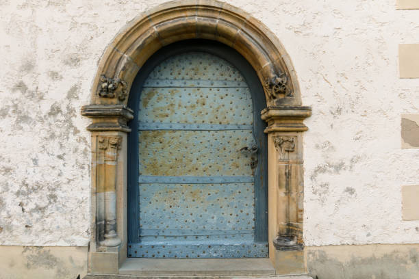 romanesque church portal with heavy iron fittings stock photo