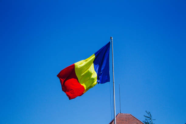 Romanian flag in the wind seen from bellow stock photo