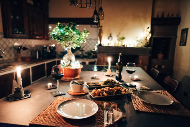 romantic dinner at home stock photo