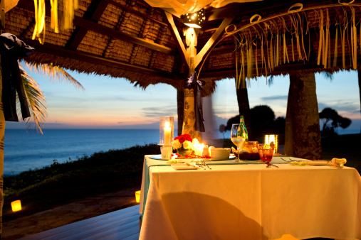 Romantic Dinner By The Sea At Sunset Stock Photo - Download Image Now