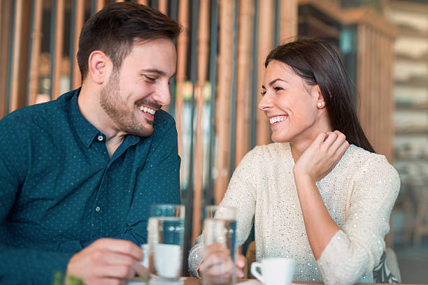Romantic loving couple having date in a cafe stock photo