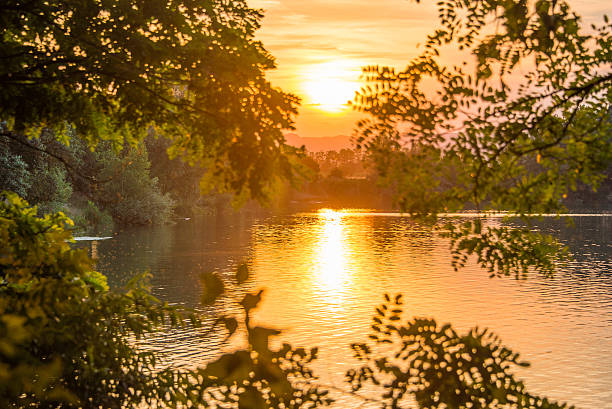 Romantic summer sunset on the lake stock photo