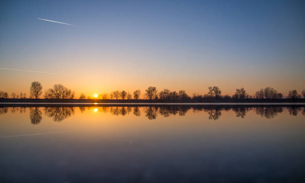 Romantic sunset on the lake stock photo