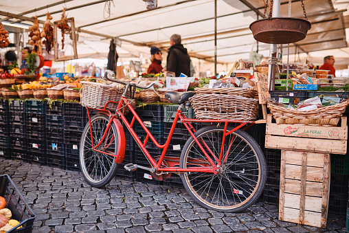 Rome, a bicycle in the traditional outdoor food market of Campo de Fiori (fields of flower)