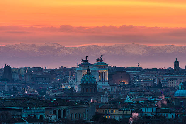 Rome at sunrise with mountains in background stock photo