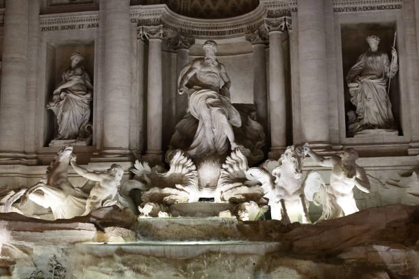 Rome - trevi fountain the beauty of rome and the trevi fountain in a night shot michelangelo artist stock pictures, royalty-free photos & images