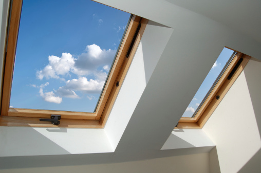 skylight windows, blue sky with puffy white clouds