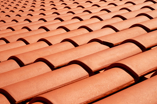Terracotta colored roof tiles close-up