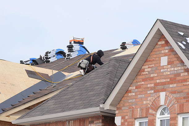 Roofer On The Job Roofer installing new asphalt shingles shingles stock pictures, royalty-free photos & images